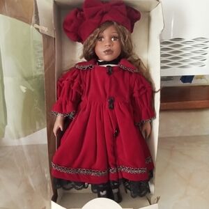 Noble Heritage Porcelain Red Doll with Bow Hat
